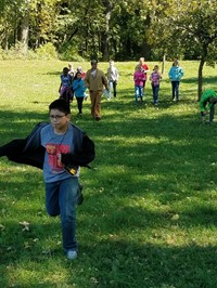 Student running (PBIS Celebration/DNR Day! Fall 2017)