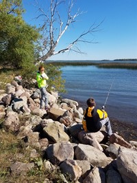 Student fishing (PBIS Celebration/DNR Day! Fall 2017)