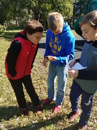 Students looking at GPS device (PBIS Celebration/DNR Day! Fall 2017)