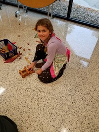 Student playing with Lincoln Logs (2nd Grade Pioneer Day - Fall 2017)