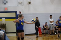 Volleyball player serving volleyball