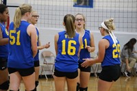 Six volleyball players on the volleyball court