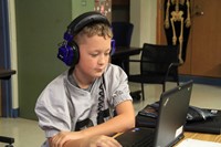 Boy looking at computer