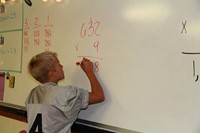 Boy solving math problem