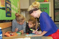 Three girls doing schoolwork