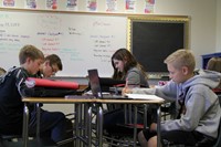 A group of students working in a classroom