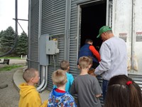 GHV First grade students visiting farm and entering grain bin