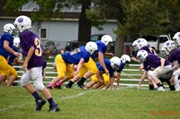 A group of football players playing a game of football