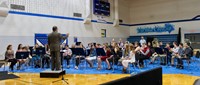 Junior high students playing in a band concert