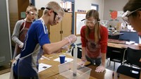 Students in science class conducting an experiment