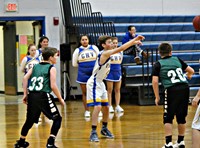 A boy passing a basketball