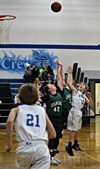 a boy shooting a basketball