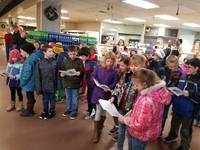 Students singing at the grocery store