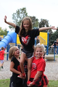 Elementary students playing on playground