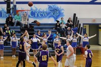 Basketball player taking a shot from under the basket