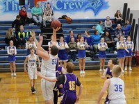 Basketball player going up for a shot