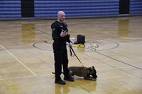 A police officer explaining how they reward the police dogs for good behavior