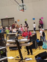 Elementary students dancing in gym