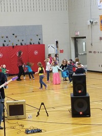 Elementary students dancing in gym