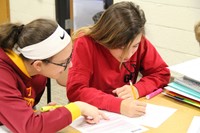 Two girls working on an assignment in class