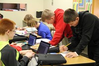 A group of students working on an assignment in class