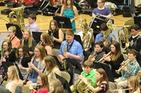 A group of junior high students playing in the band