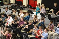 A group of junior high students playing in the band