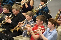 A group of boys playing in the band