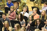 A group of junior high students playing in the band
