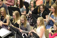 A group of girls playing the clarinet