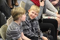 Two boys talking before the band concert