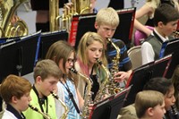 A group of intermediate students playing in a band concert