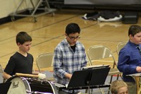 Intermediate school band students performing