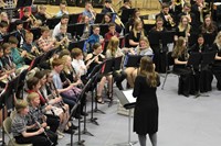 A band teacher conducting the band